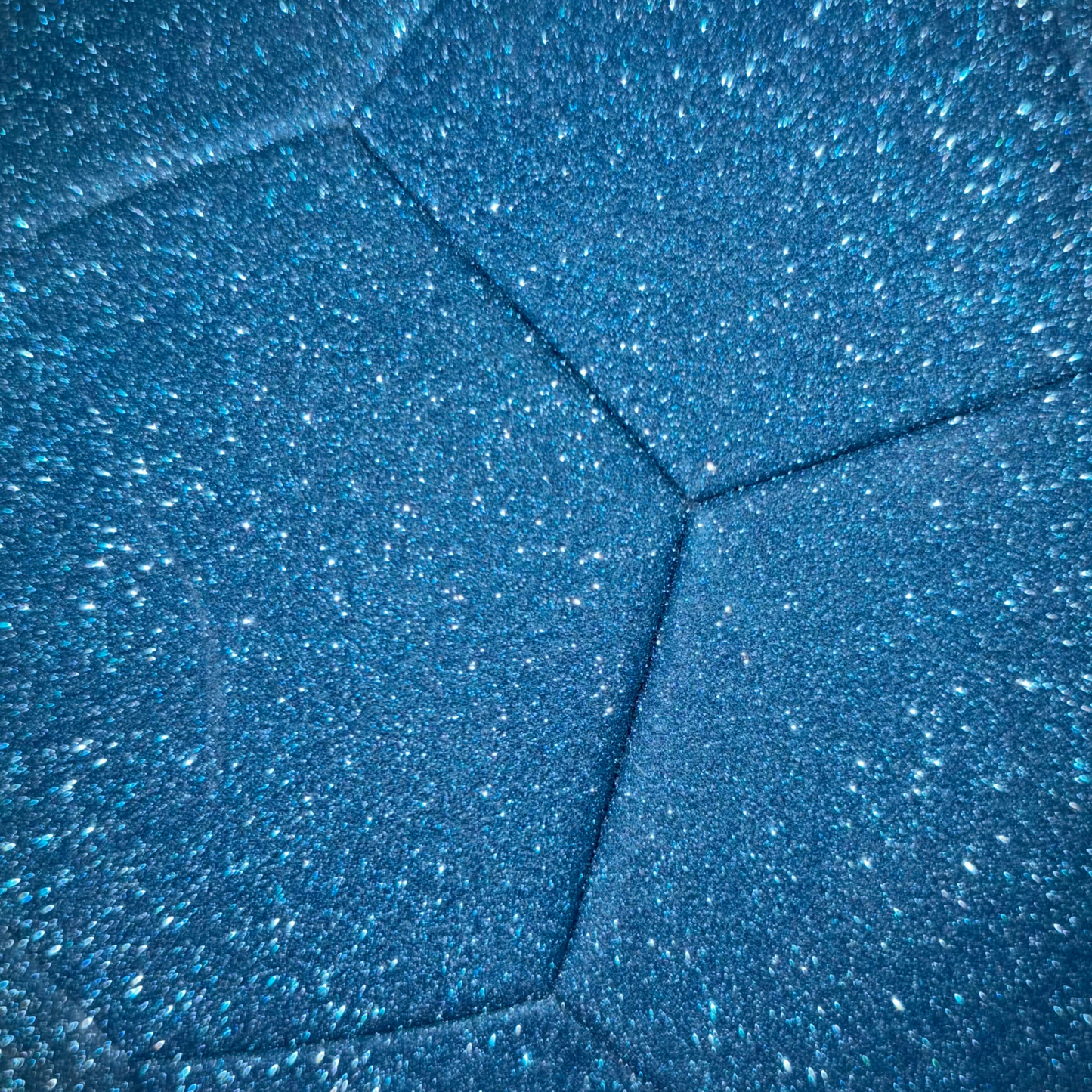 Closeup of blue glitter soccer ball exterior