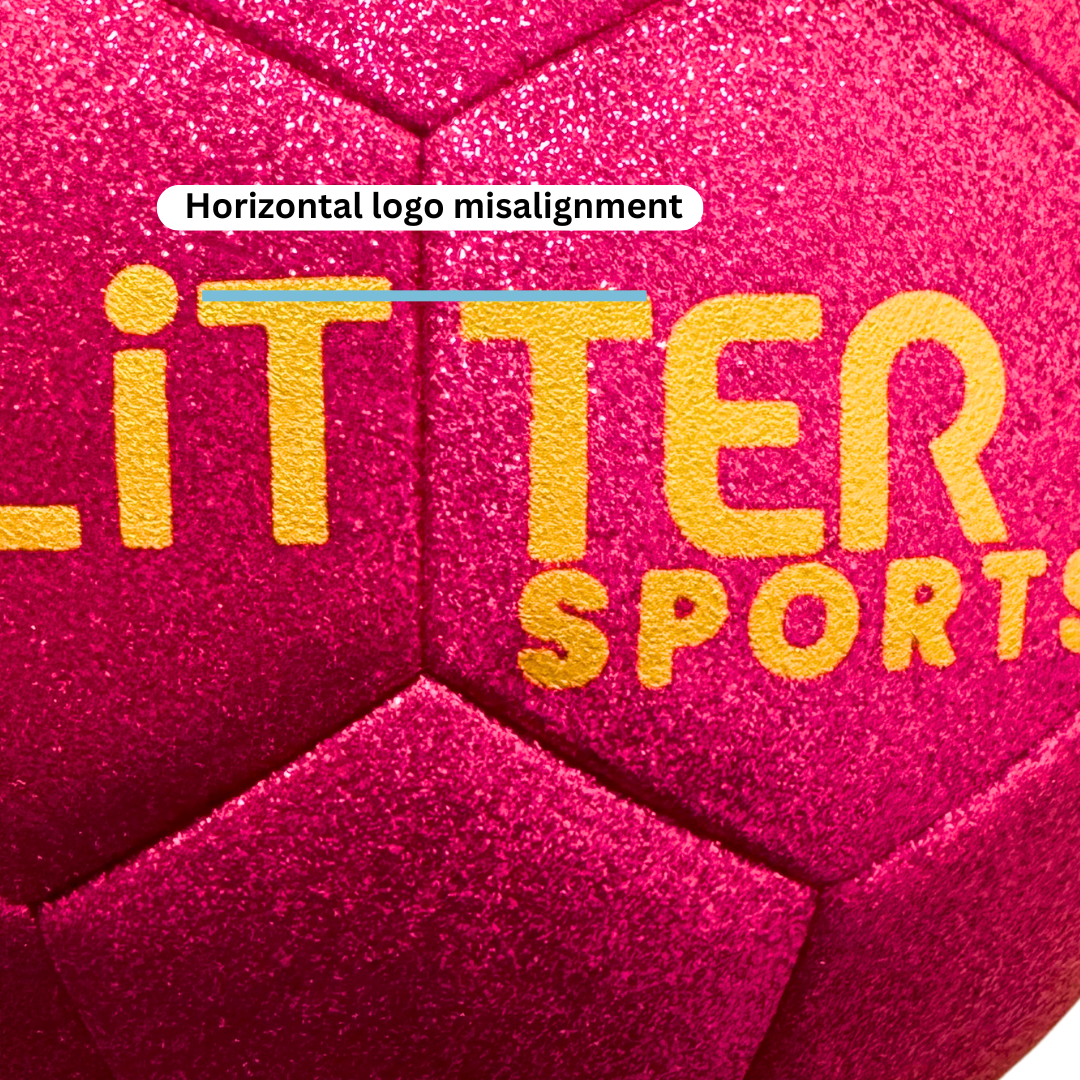 Close up of pink glitter soccer ball exterior with gold logo. Blue line at the top of the logo and white text bubble saying 'horizontal logo misalignment.'