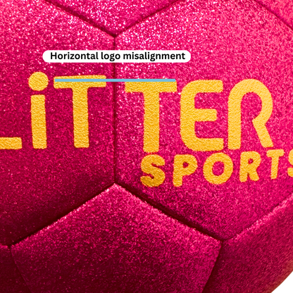 Close up of pink glitter soccer ball exterior with gold logo. Blue line at the top of the logo and white text bubble saying 'horizontal logo misalignment.'