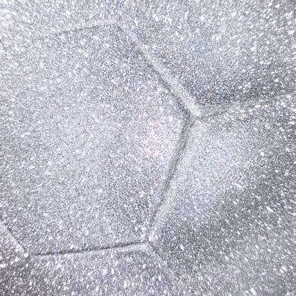 Close up of silver glitter exterior of soccer ball.