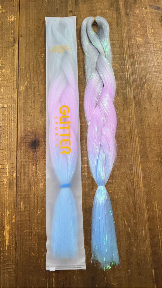 Girls rainbow ombre tinsel hair extension braids in silver, lavender and blue on wood background.