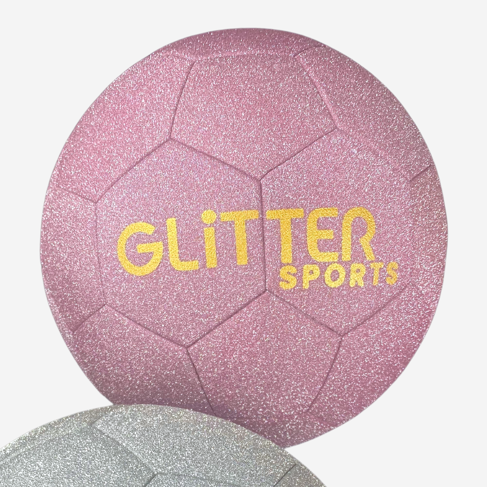 Pastel pink glitter soccer ball with gold 'Glitter Sports' logo next to silver glitter ball on white background.